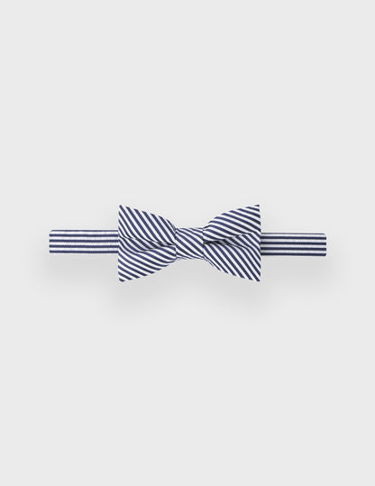 Bow tie in navy blue striped silk and cotton seersucker