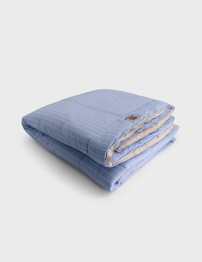 Nido blue and white striped and checked bed quilt