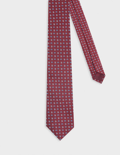 Silk tie with dark red motifs