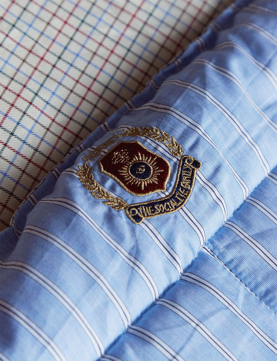 Nido blue and white striped and checked bed quilt